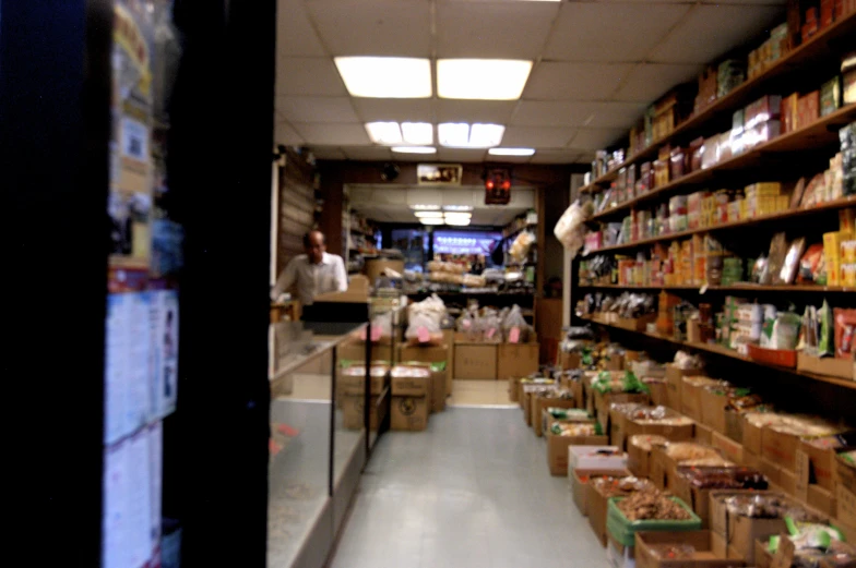 an aisle inside a store with a variety of food