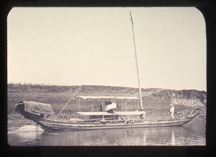 a boat is on the water and is being used as a houseboat