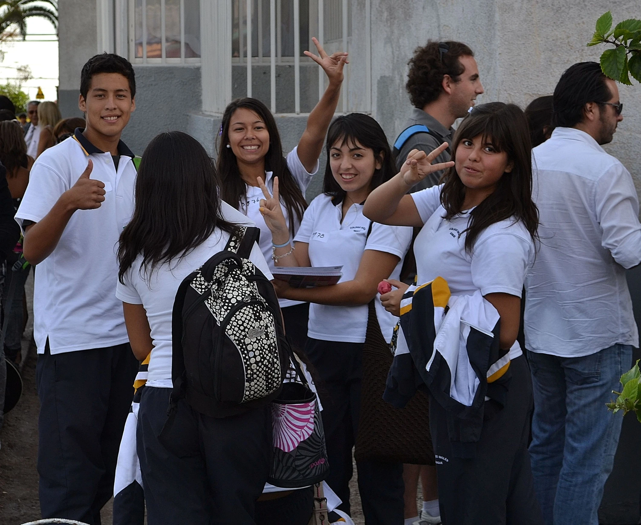 a group of young people standing next to each other