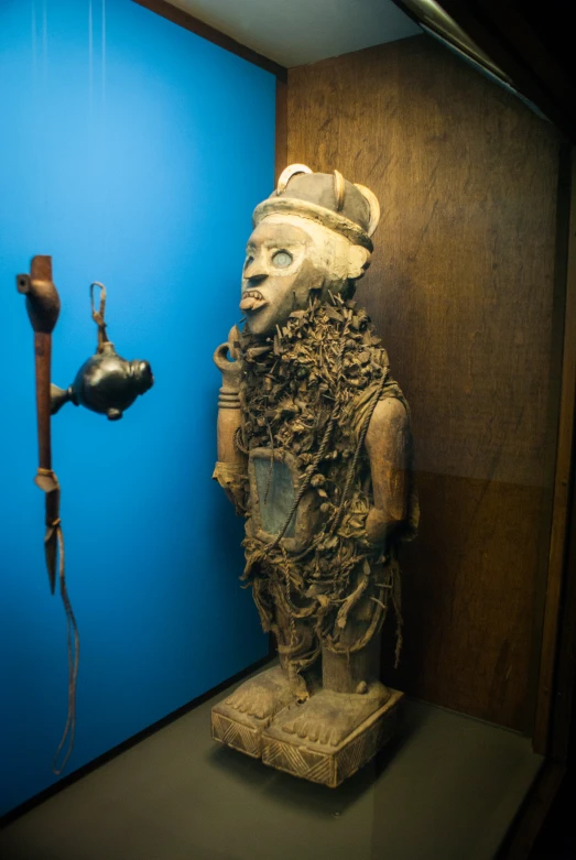 a statue in an area next to two sinks