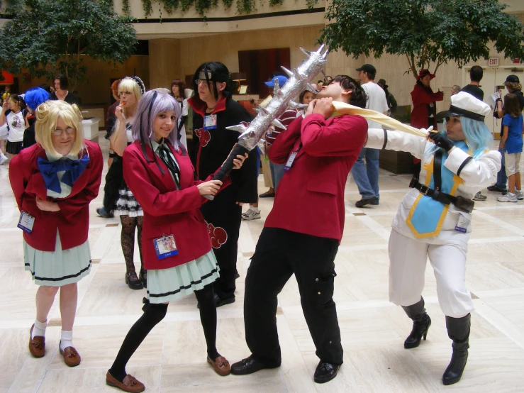 the young people are playing the instruments in costumes