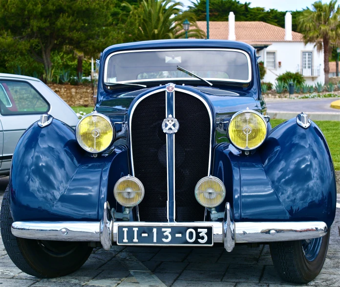 a close up of the front end of an old car