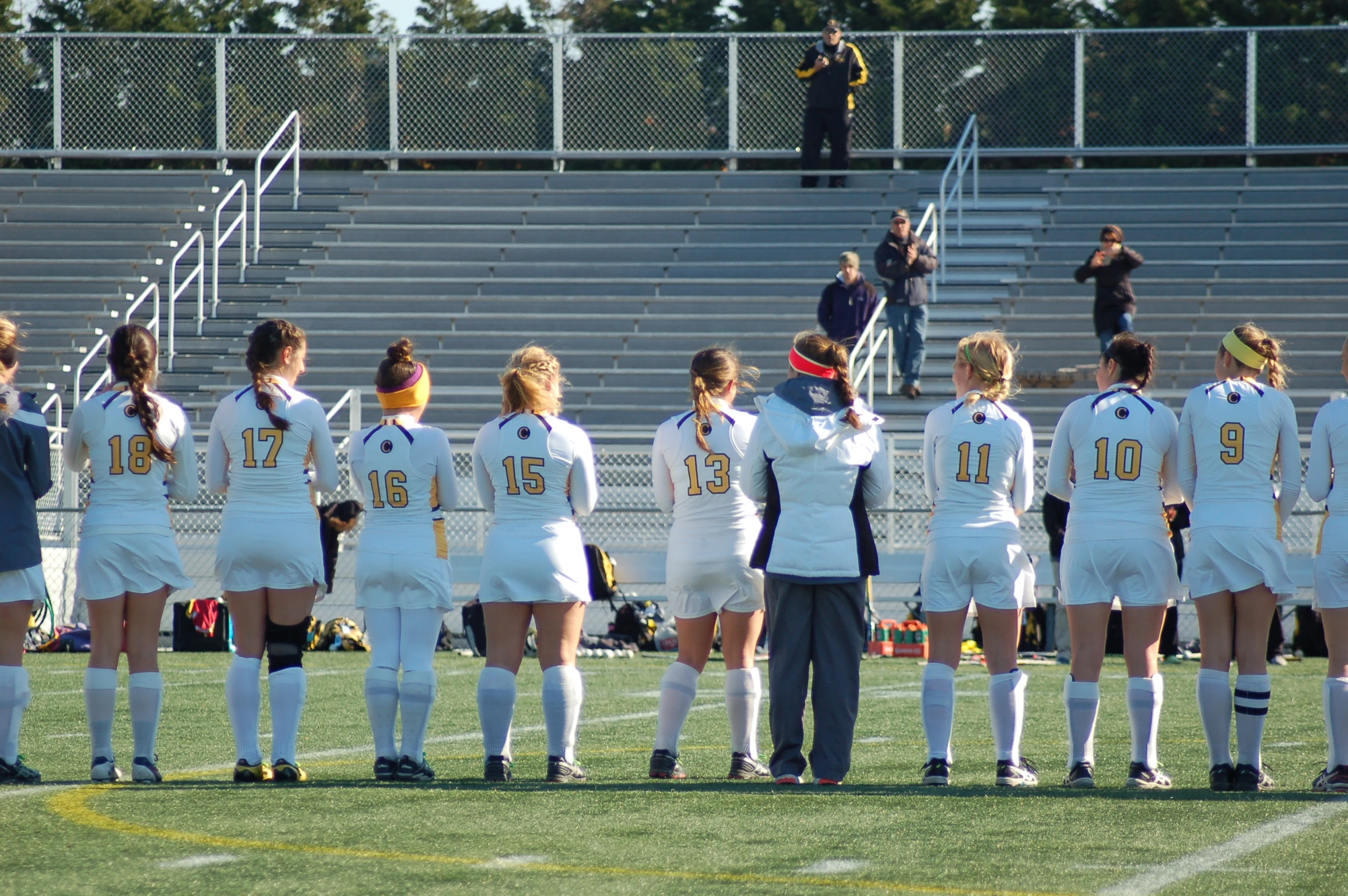 an image of girls soccer team with coach