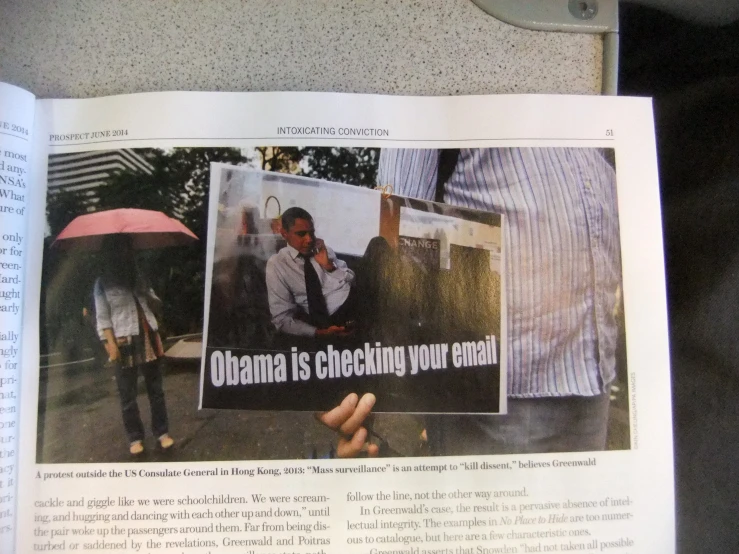 the newspaper has a man holding an umbrella