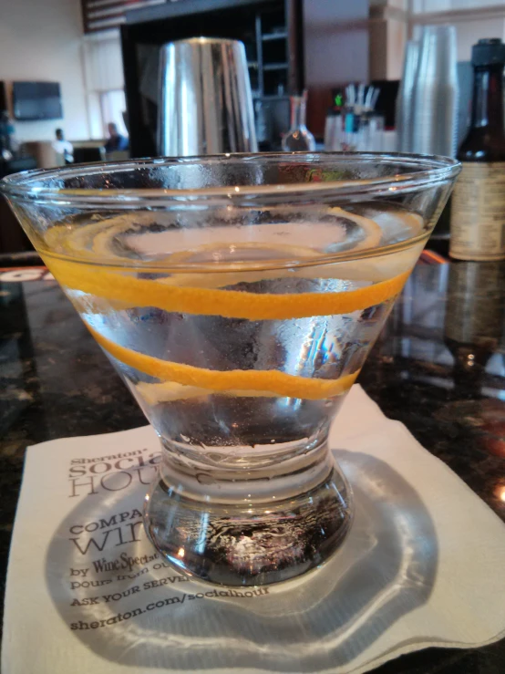 a glass of fruit on top of a counter top