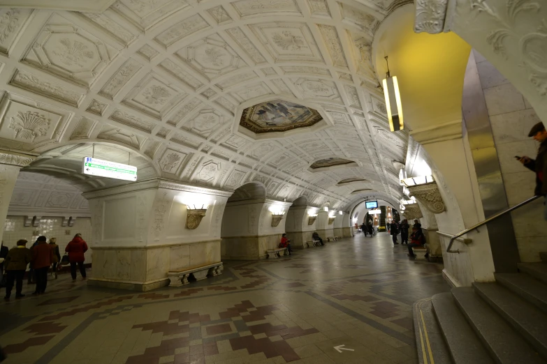 people standing in the middle of an empty corridor