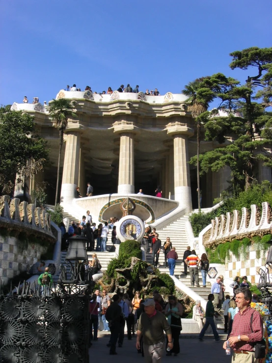 the stairs lead up to a large building