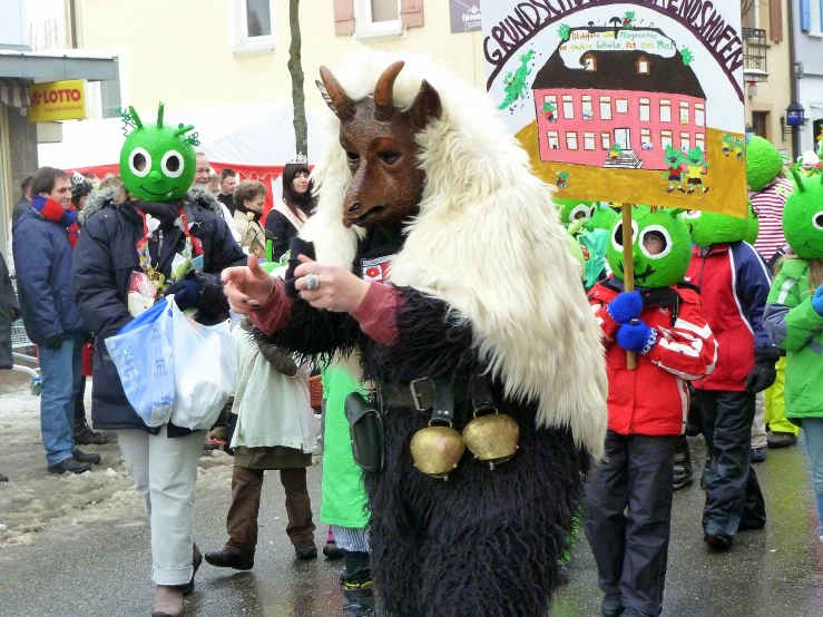 people walking down the street with green and white costumes