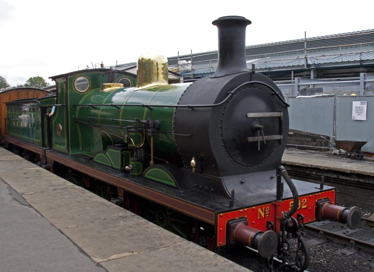 a train on a track next to a platform