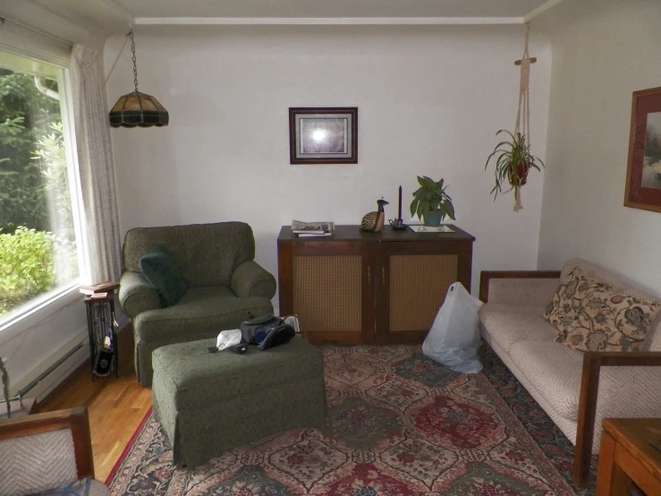 a living room area with a lamp and a couch