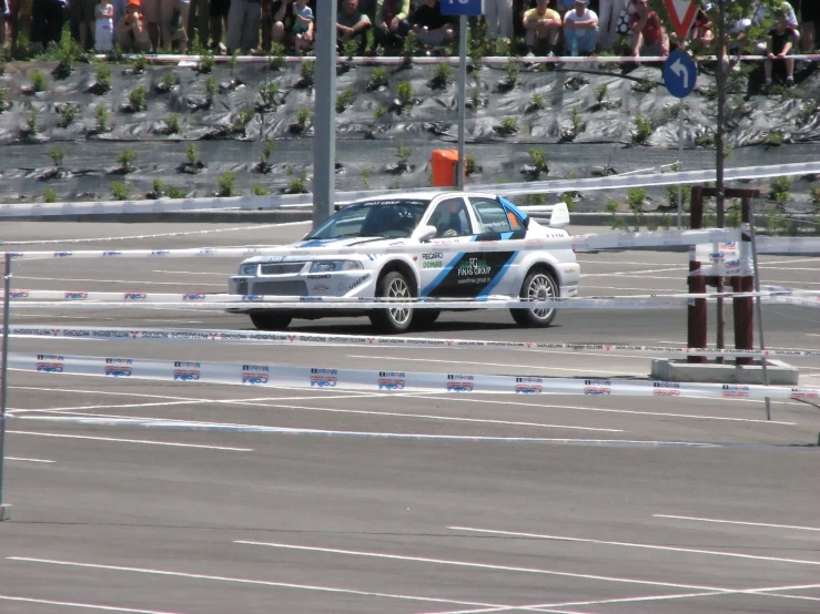 a car that is sitting on a track in the street