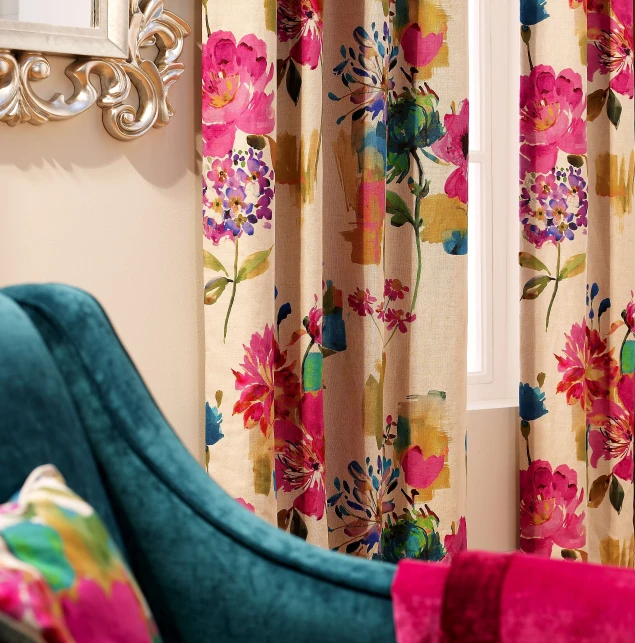 colorful curtains hang in front of a fancy chair