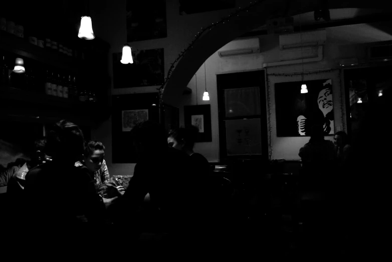 a crowd of people sitting at tables in a building