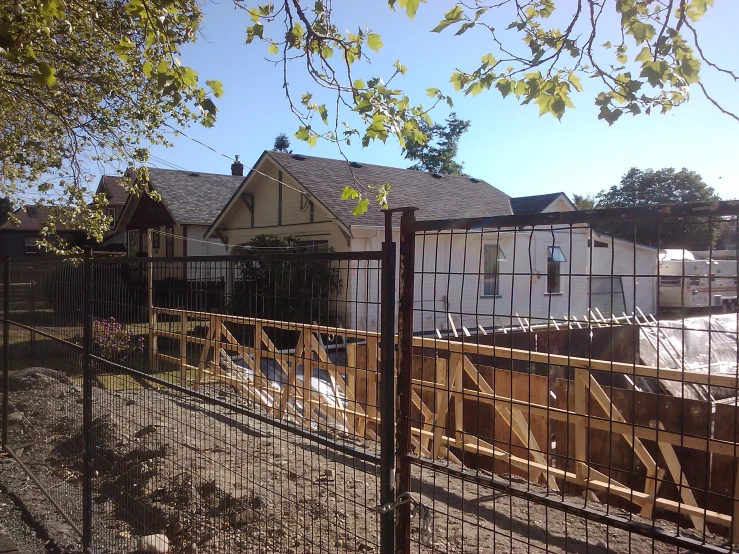 the fence has been erected near some buildings