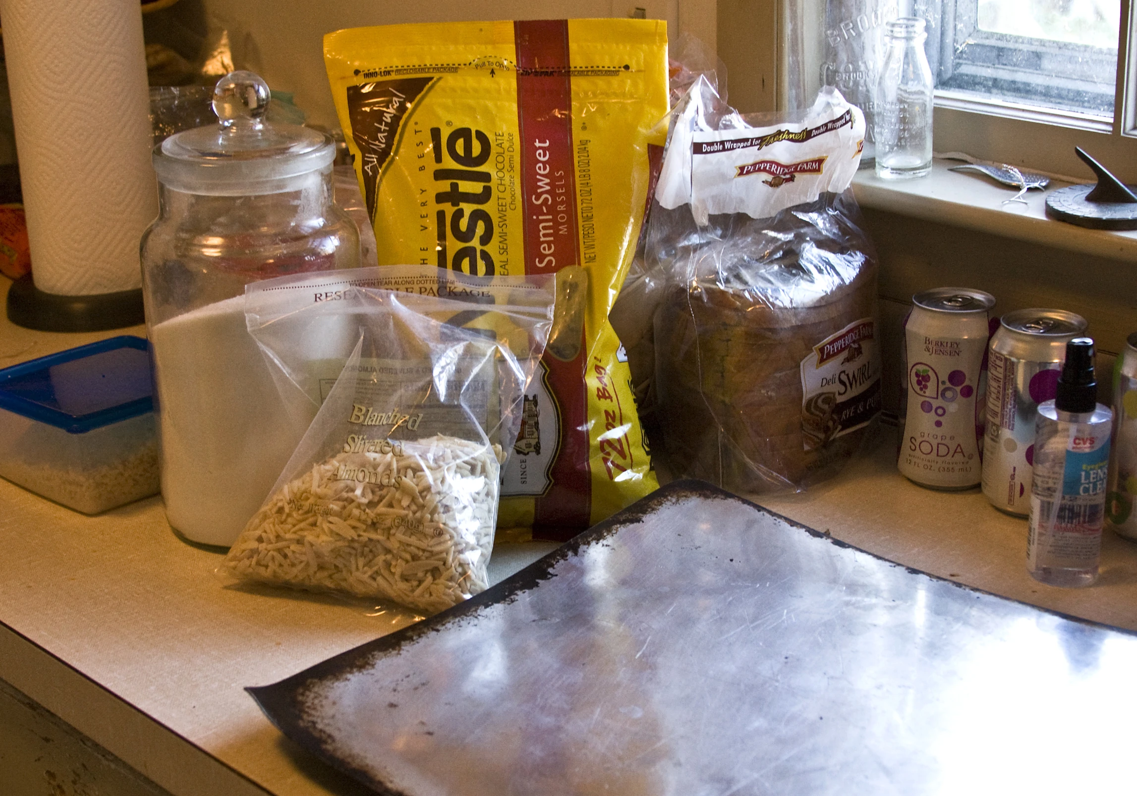 a counter has some bags and bottles on it