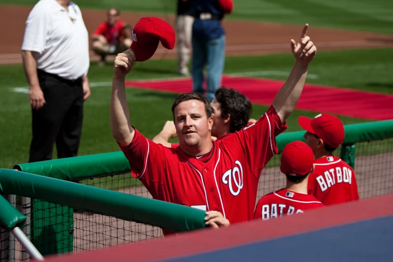 the two baseball players are cheering at the game