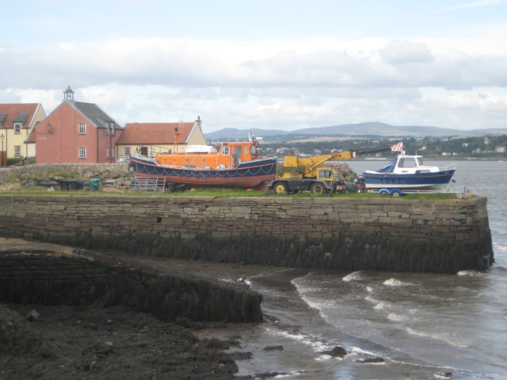 several boats in the water near some buildings