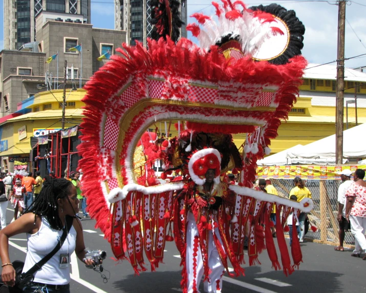 a parade with two men and a woman in costume