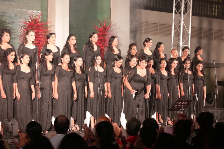 a choir performs a song for an audience at a convention