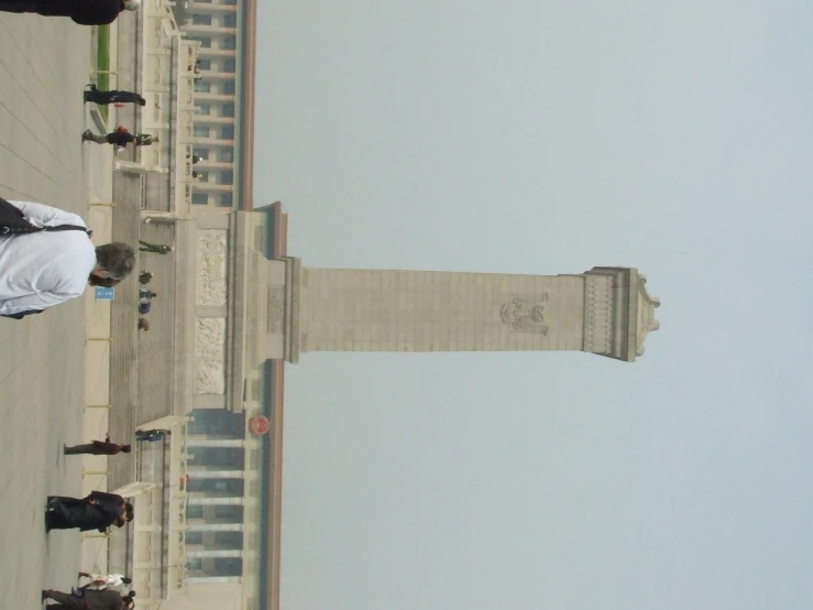 people looking over the top of a building