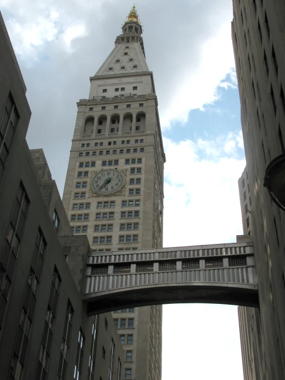 the clock tower is very tall and has a roof above