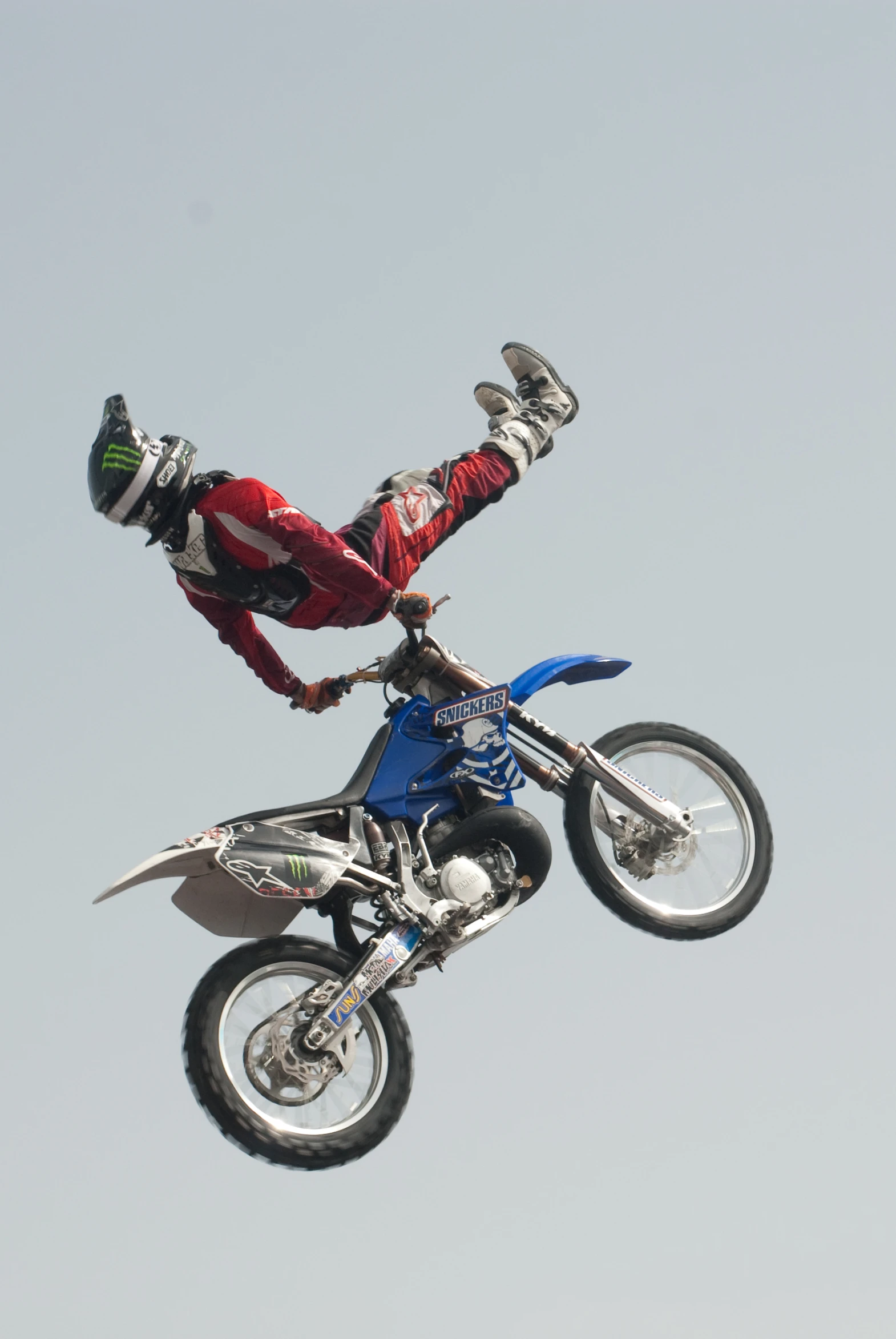 a man riding a dirt bike while being upside down