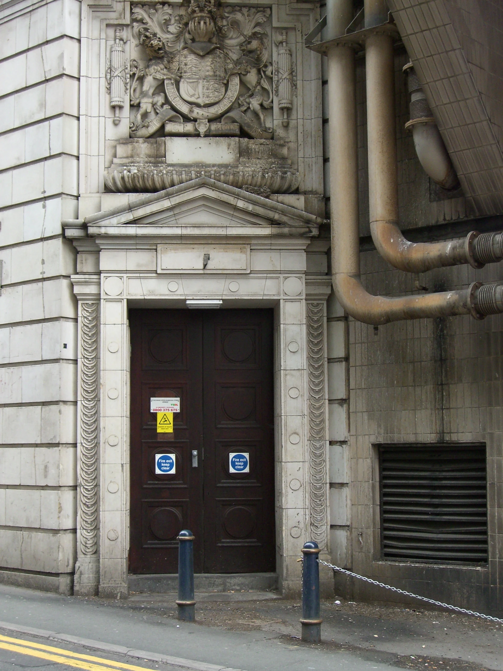 the entrance to an old building with an odd design