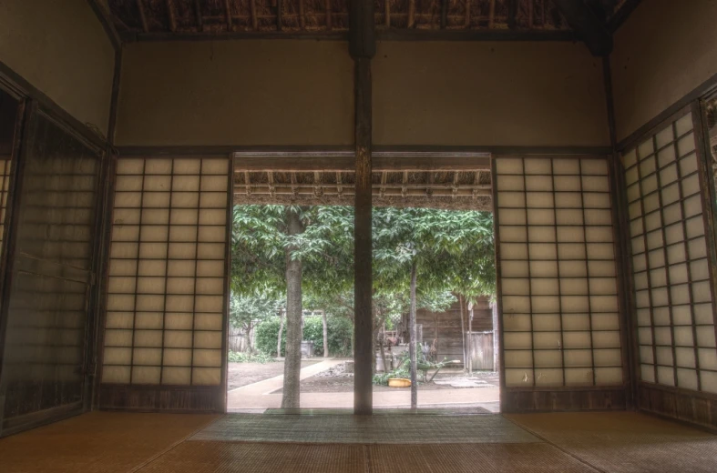 a room with lots of wood panels and windows