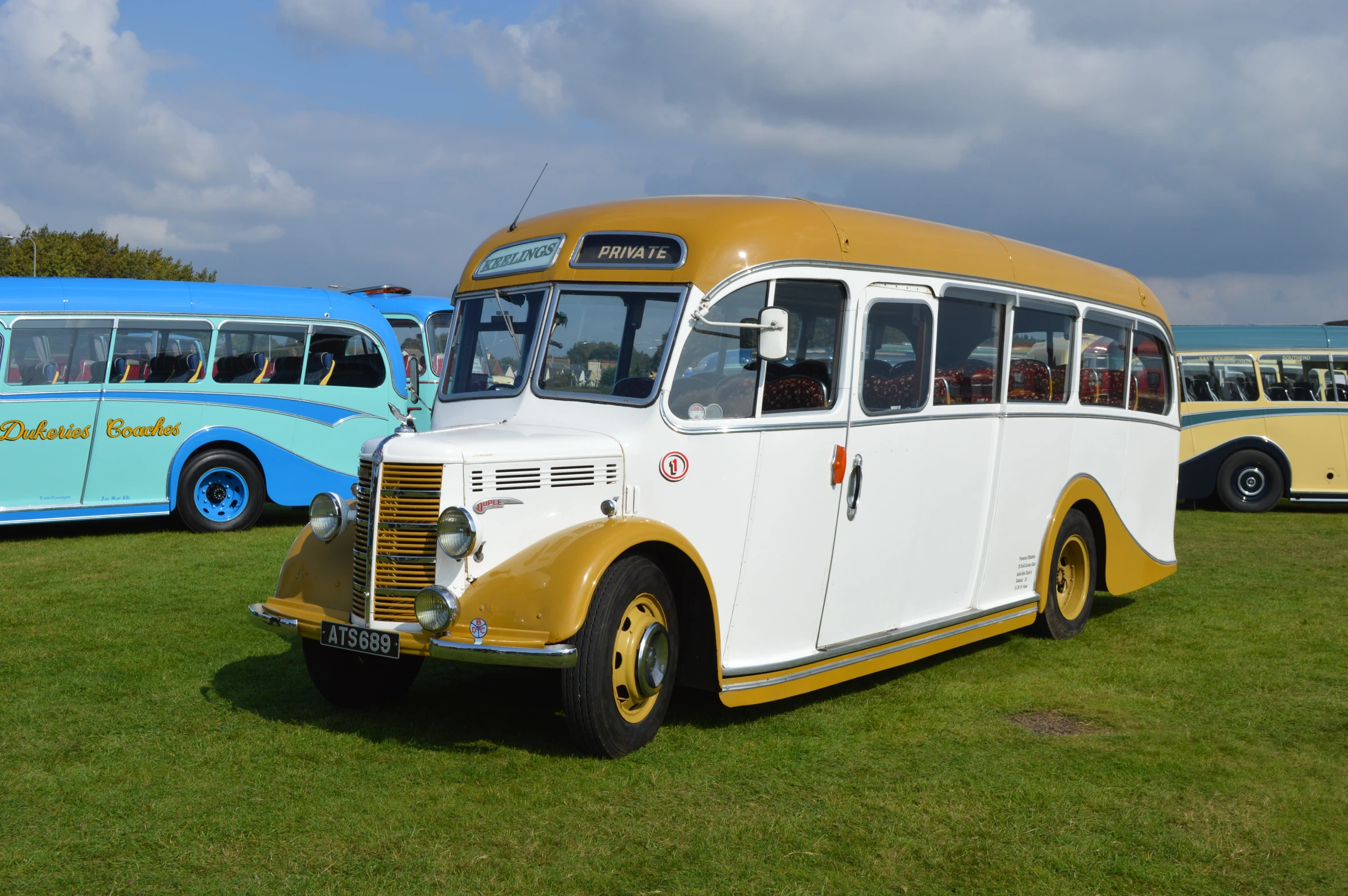 an older bus is parked near other vehicles