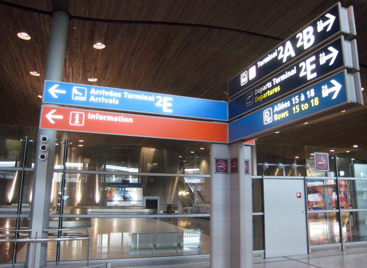 there are various directional signs at the airport