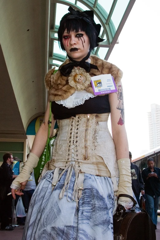 a woman with makeup and costume on a sidewalk