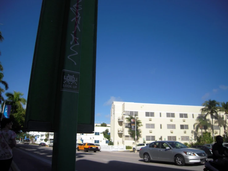 cars parked along a street next to a parking meter