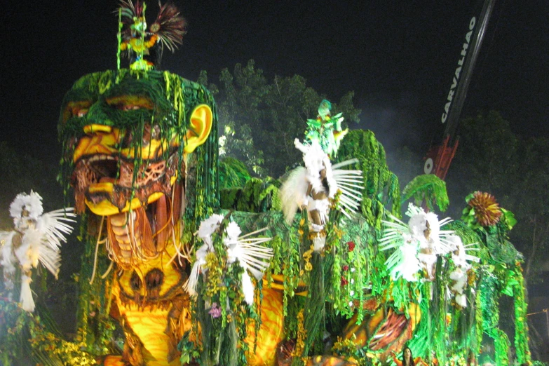 performers with lights in their ears in a dark park