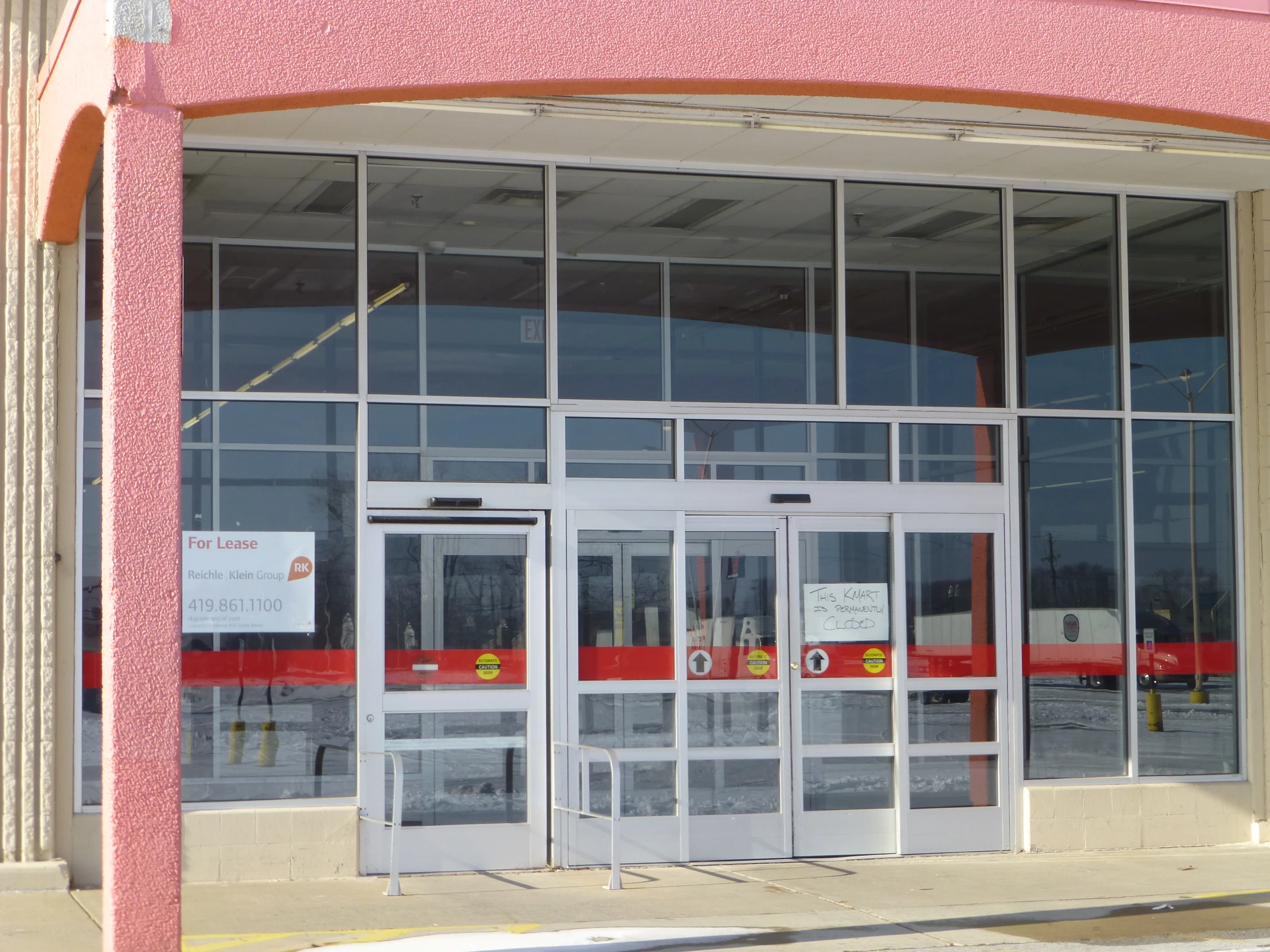 glass doors on a building with no people or vehicles