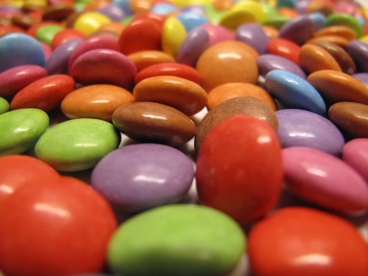 a close up of candy candies with different colors