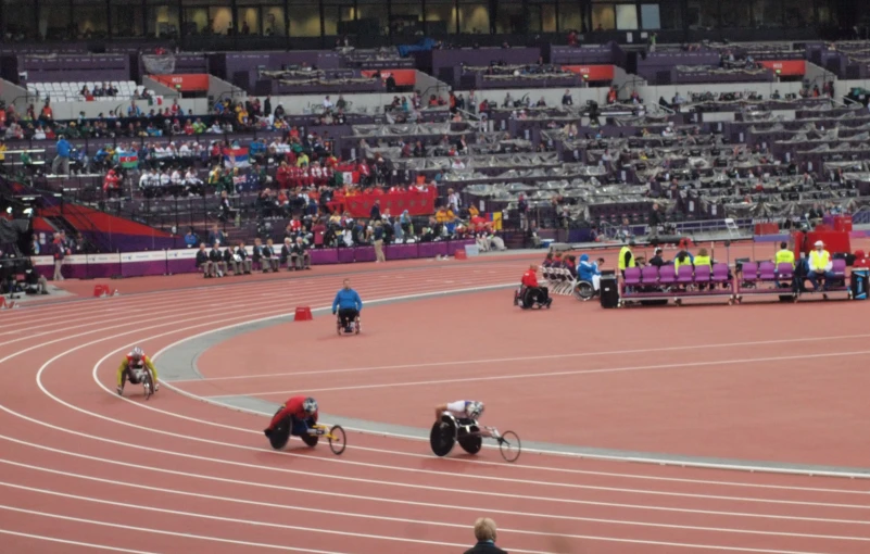 a bunch of athletes running around on track