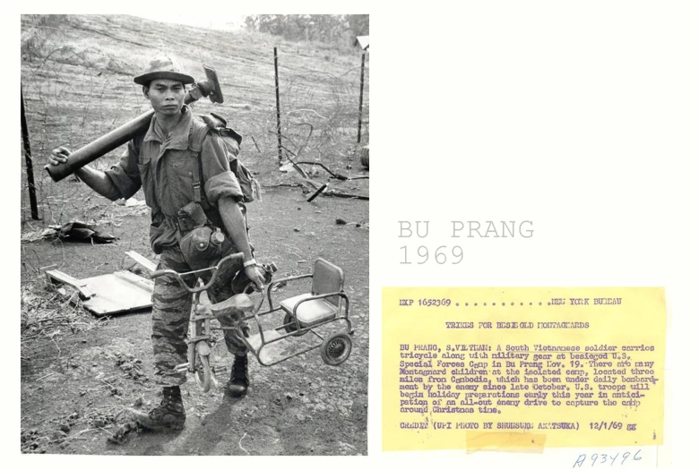 a black and white image of a man holding a skateboard