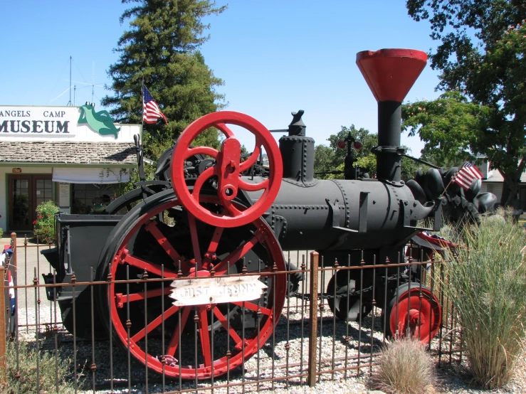 an old steam engine sits at the museum