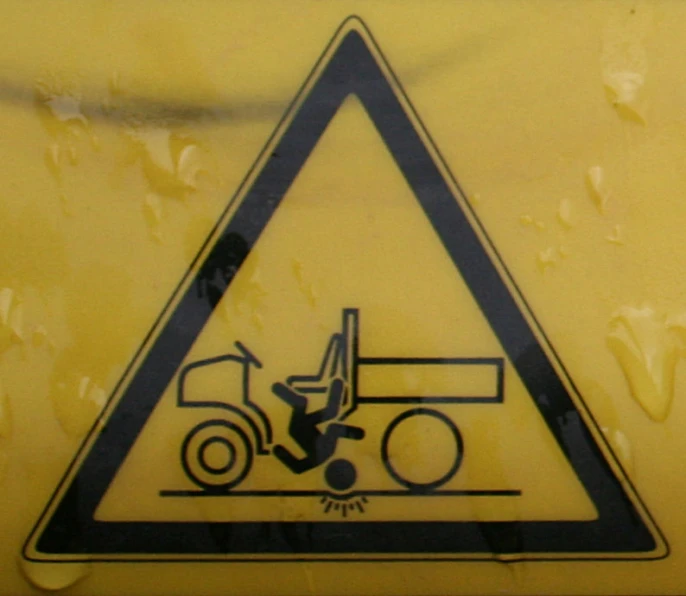 a sign on a sign with a tractor