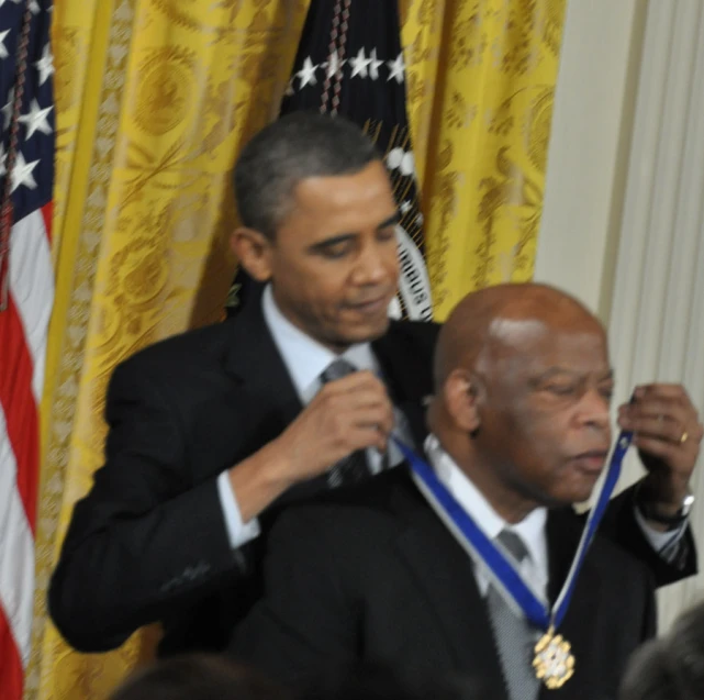 president obama presents another man with a medal