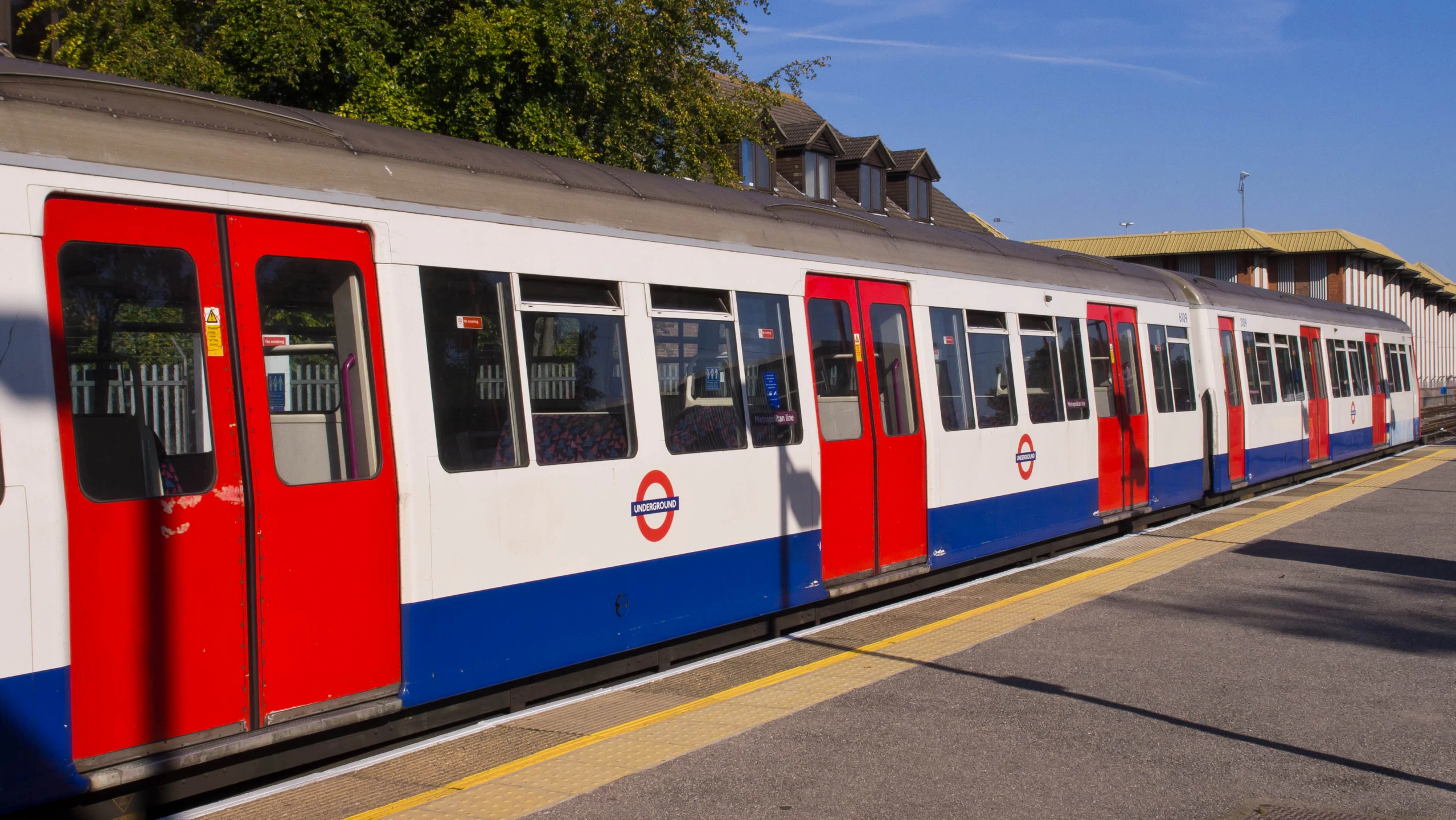 an image of a passenger train at the station