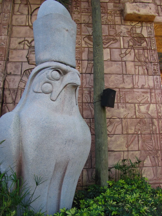 a small cement head outside a stone building