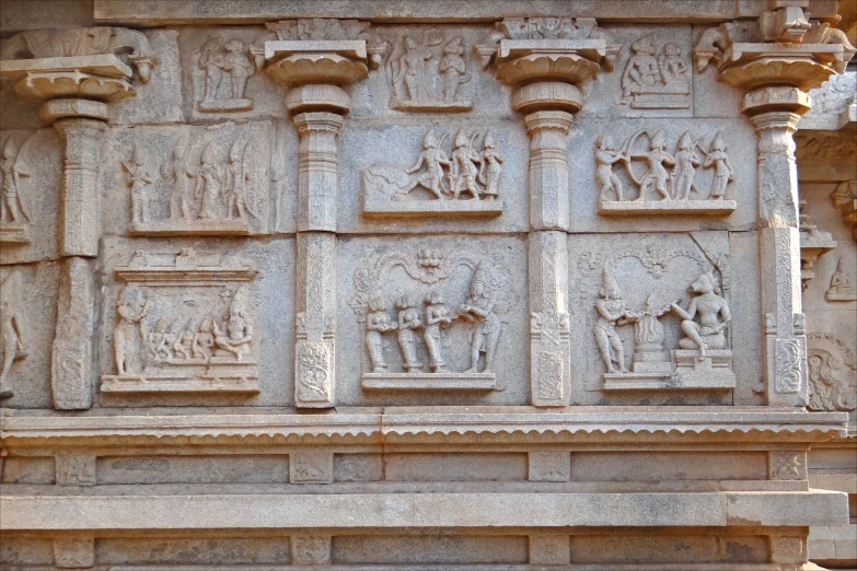 sculptures in indian art displayed on an old building