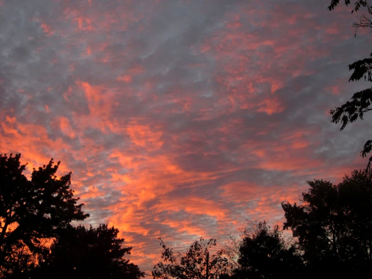 a beautiful sky with orange clouds and purple clouds