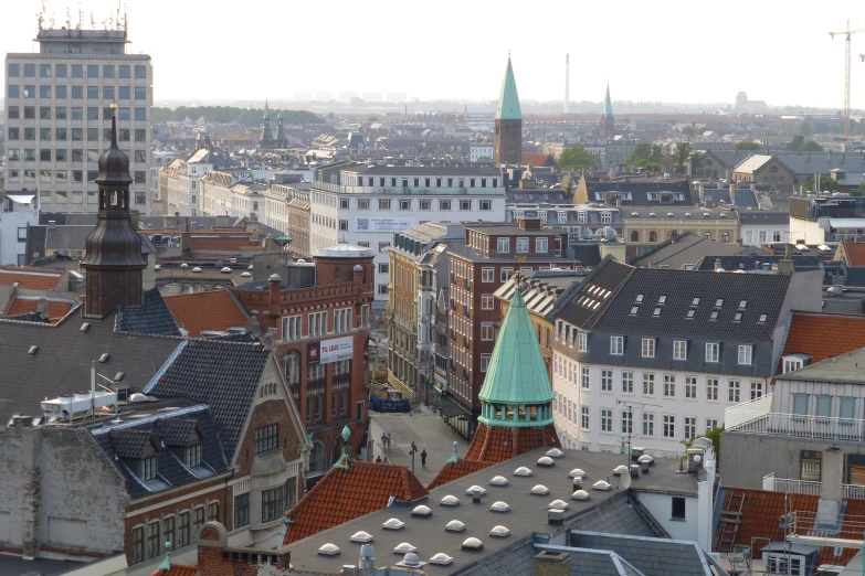 a view of a city from the top of some buildings