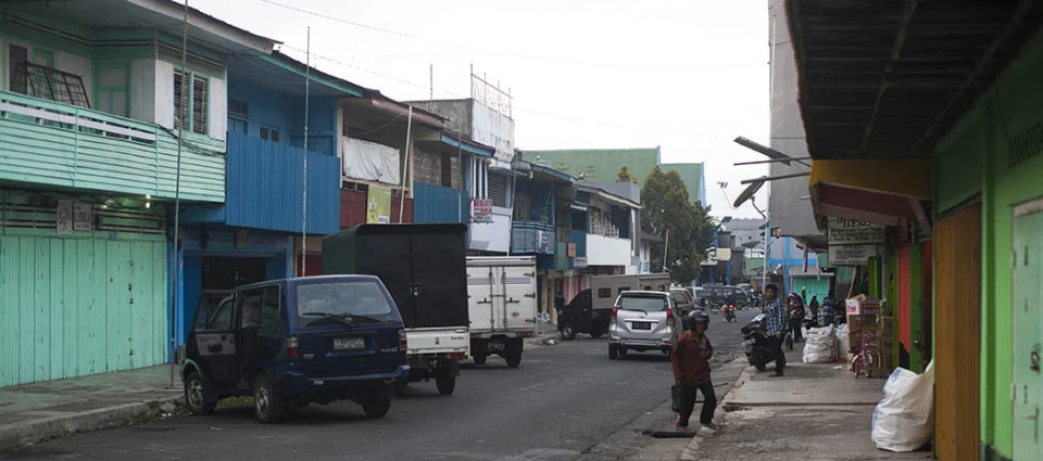 a busy street in the middle of a small town