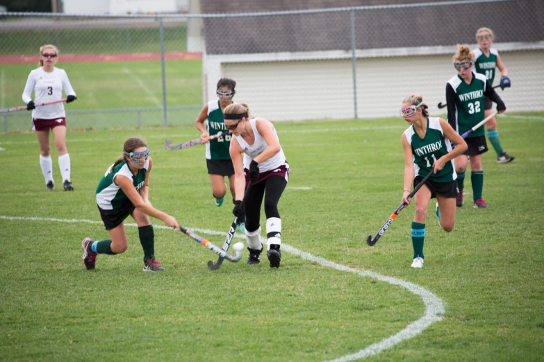 the female field hockey team is playing soccer