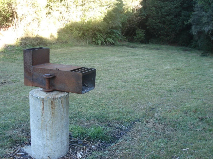 a mailbox sitting on top of an old pole