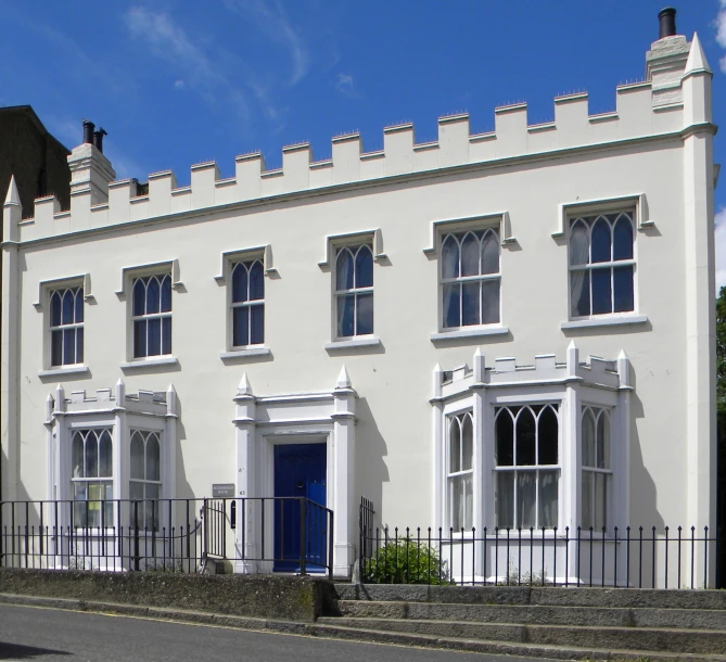 a large white building with lots of windows