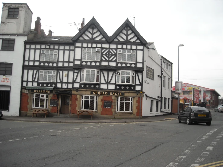 a building on the corner of an urban road